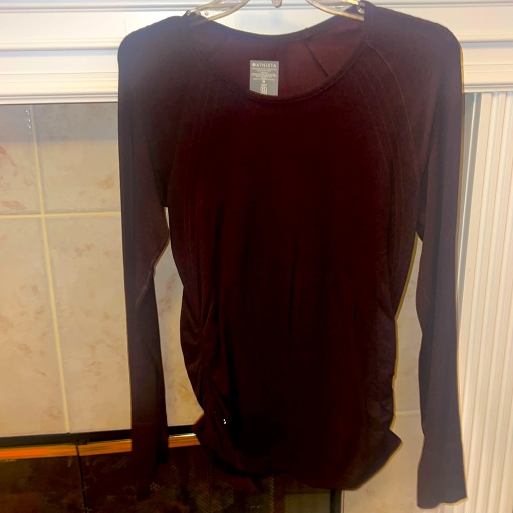 Athleta size medium long sleeve top with thumb holes. Burgundy